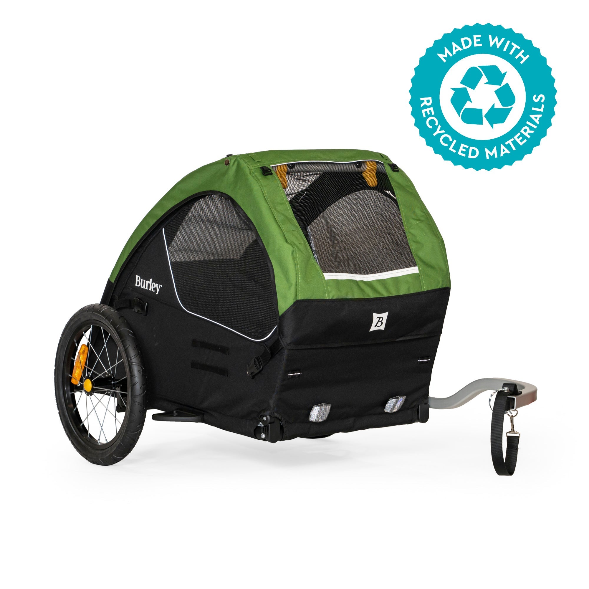 Green and black bicycle trailer for dogs with a recycling logo 