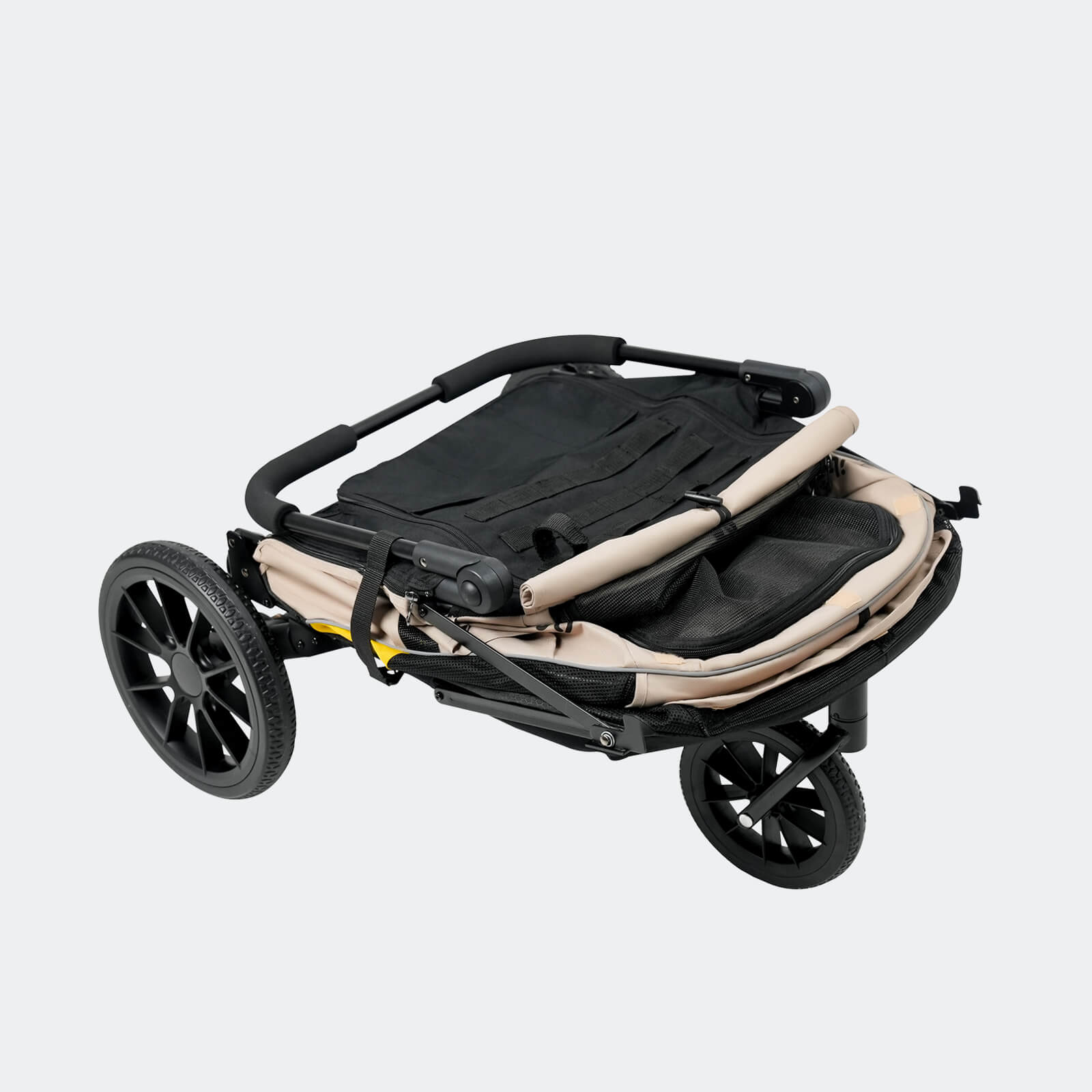 Black and beige pet stroller collapsed for easy storage
